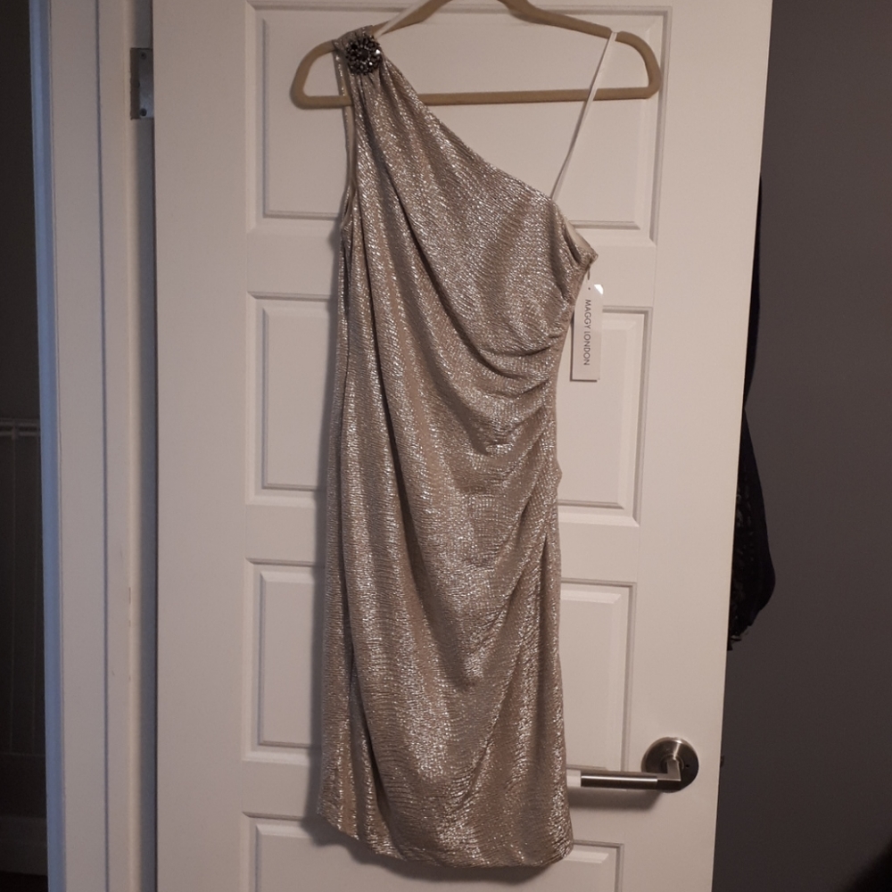 Gold knee length one shoulder dress.